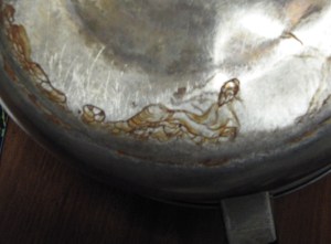 chinadolia It looks like an oriental man reclining to me; perhaps an oriental Jesus?